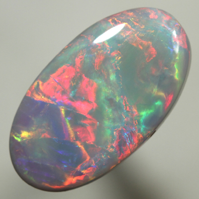 SOLID SEMI BLACK OPAL Top quality. Bright, strong fire in rolling flashes. SEE VIDEO